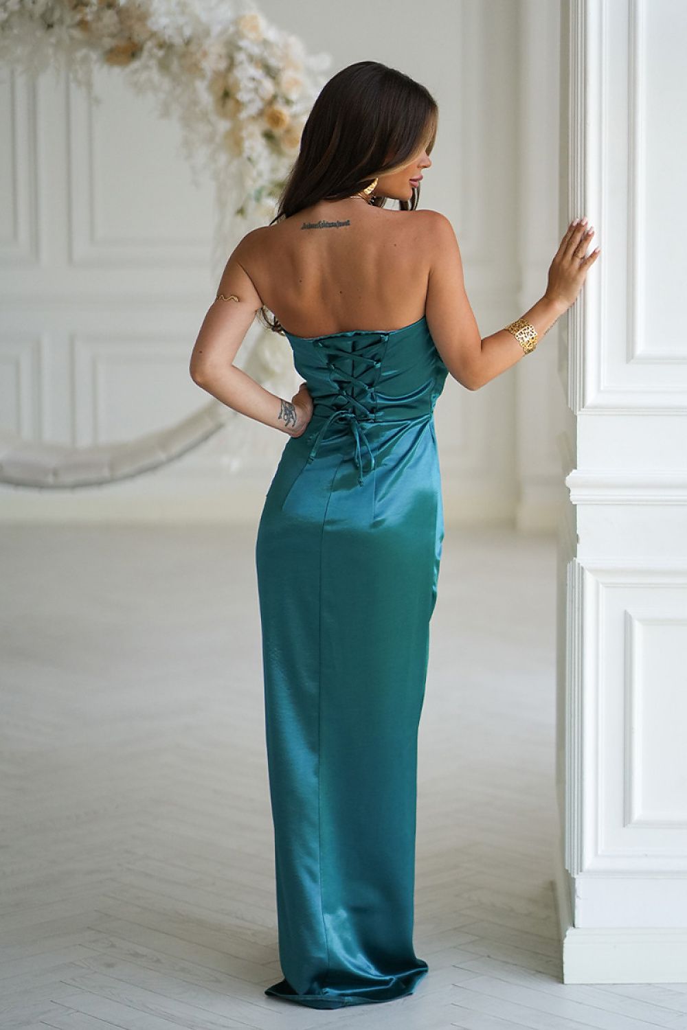 Back view of Bicotone emerald long satin dress with corset lace-up back and smooth finish