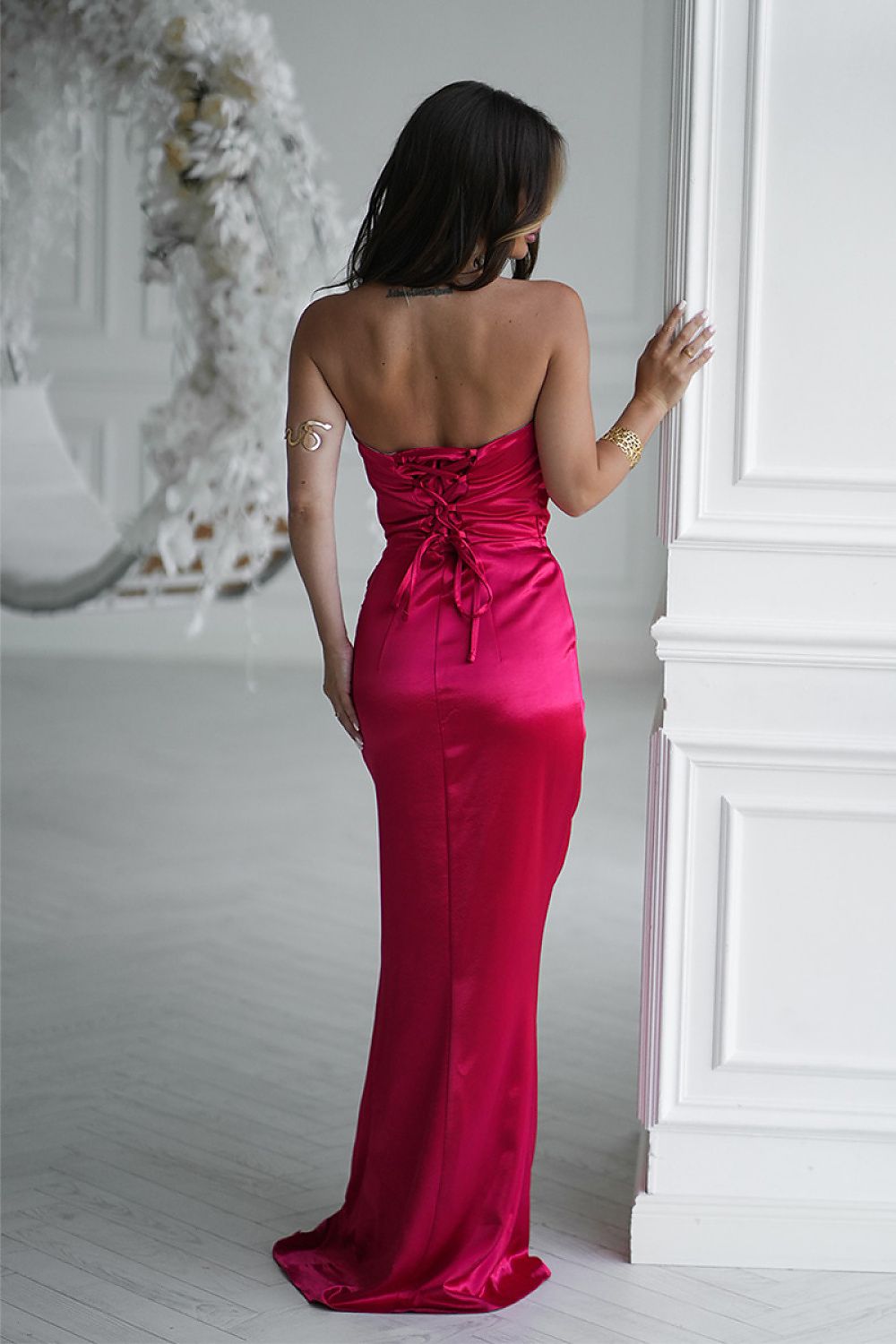 Back view of Bicotone red satin long dress with lace-up corset back detail
