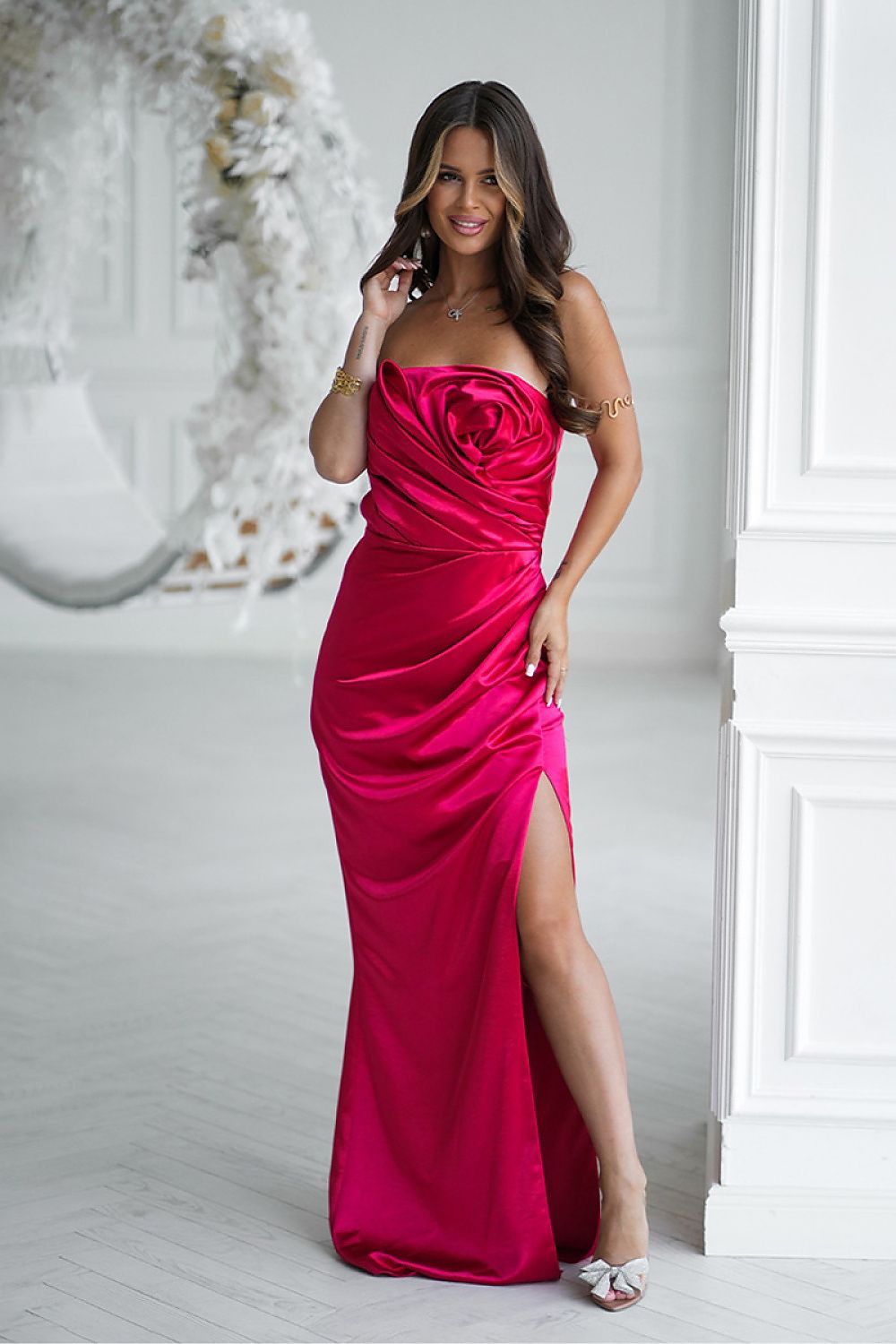 Bicotone red strapless satin long dress with draped rose detail and thigh slit
